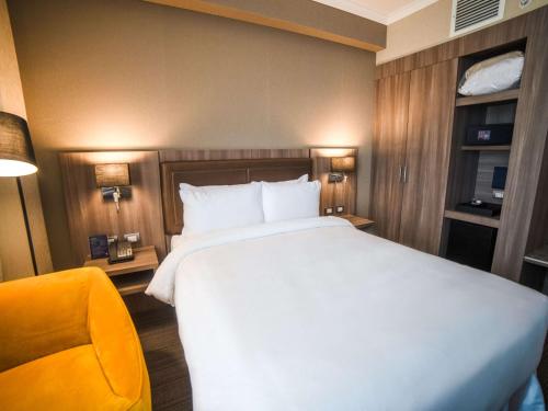 Ένα ή περισσότερα κρεβάτια σε δωμάτιο στο Doubletree By Hilton Trujillo