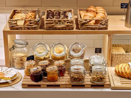 a bakery with shelves filled with various types of bread at Musik Boutique Hotel in Barcelona