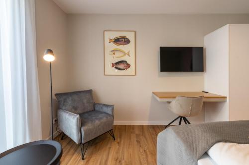 Una televisión o centro de entretenimiento en Design Apartments Potsdam - Luise
