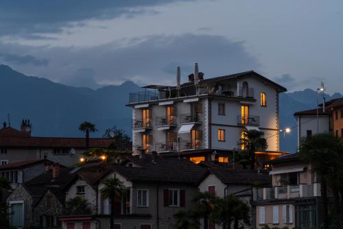 a large white building sitting on top of houses at Villa Sophia in Gerra