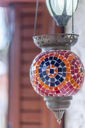 a stained glass lamp hanging from a light pole at Sikia Holiday House in Kalamaki Zakynthos in Kalamaki