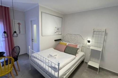a small room with a crib in a room at Gabriel Apartments - JAFFA Street 214 Suits + Balcony in Bet HaKerem