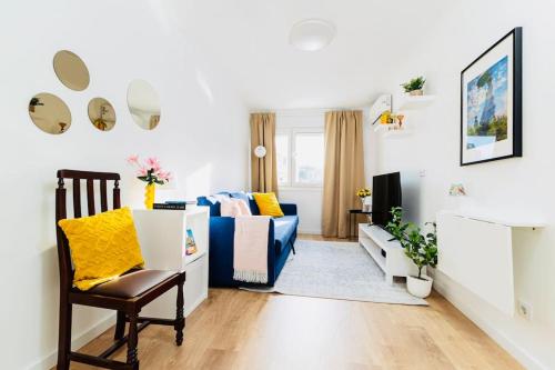 a living room with a couch and a chair at Modern 3 bedroom Flat in Lisbon in Lisbon