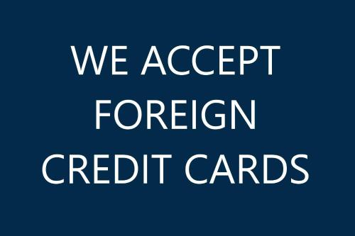 a sign that says we accept foreign credit cards at Boutique Hotel Onyx in Saint Petersburg