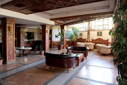a large living room with couches and tables at Hotel Centar Balasevic in Belgrade