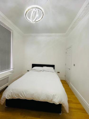 a white bedroom with a bed and a white ceiling at VIP penthouse own bathroom one bedroom on suite in Wolverhampton