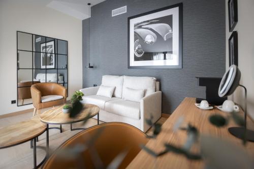 a living room with a couch and a table at Hotel & Spa Convento San Francisco in Soria