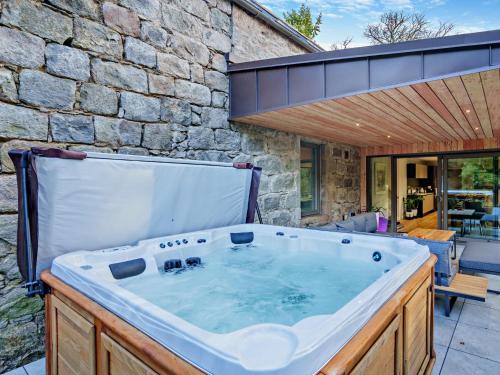 a hot tub in the backyard of a house at 4 Bed in Newmachar 93914 in Dyce