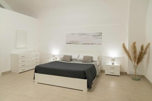 מיטה או מיטות בחדר ב-Apartment - White Place - Affitti Brevi Italia