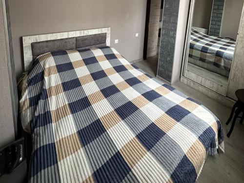 Ένα ή περισσότερα κρεβάτια σε δωμάτιο στο Апартаменты в Кобулети