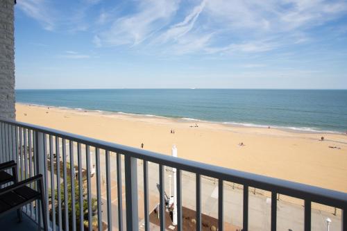 a view of the beach from the balcony of a condo at Aqua Vista Resort Hotel in Virginia Beach