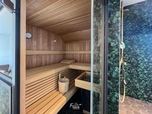 a sauna with a shower in a building at ROOFTOP Garden ACHT in Olpenitz