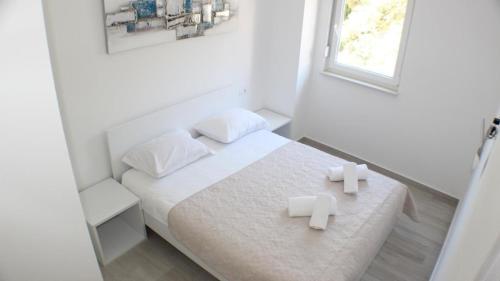 En eller flere senger på et rom på Appartement in Promajna - b55199
