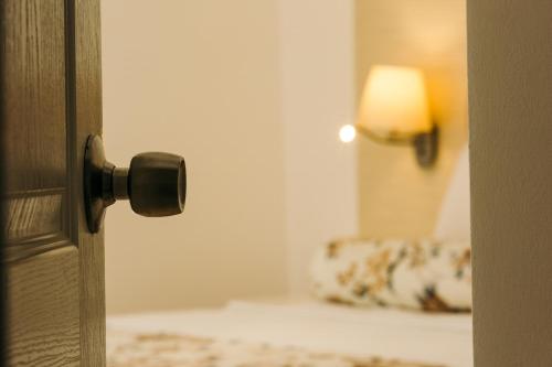a doorhandle to a door with a mirror in a room at Monta Verde Hotel & Villas in Oludeniz