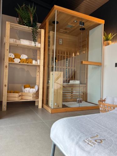 a glass display cabinet with pastries in it at 16 Lakes Hotel in Grabovac