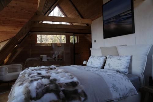 a bedroom with a bed with snow on it at Centrum Terapii Leśnej in Zawoja