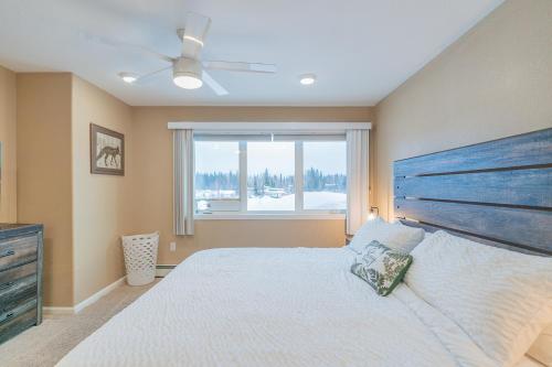 a bedroom with a large bed and a window at The Chena River House North Suite in Fairbanks