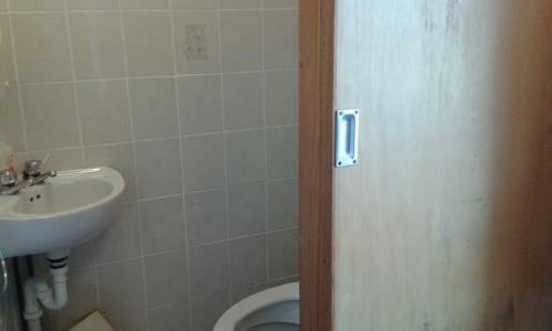 a bathroom with a sink and a toilet at Achill West Coast House in Dooagh