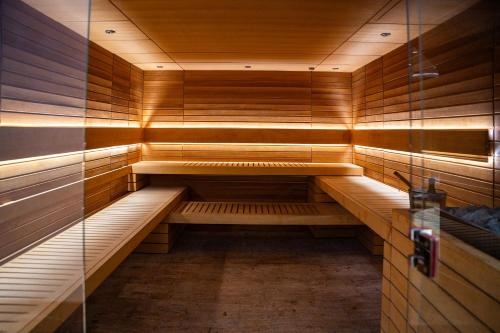 an empty sauna in a building with wooden walls at A Hoteli - Hotel Park in Vrnjačka Banja