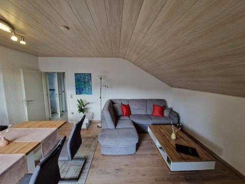 a living room with a couch and a table at Ferienwohnung Harmonie in Sulzbach