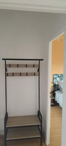 a black bunk bed in a room next to a bedroom at Michel et Florence in Peyrehorade
