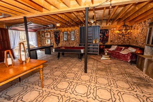 a living room with a pool table in a room at Luxury Mountain Mansion Huge Pool, Sauna, 7000sqft in Windham
