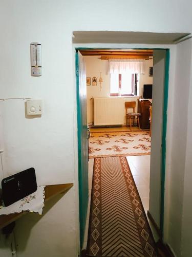 an open door to a room with a hallway at Άγιος Μηνάς - Αστράκα View in Ágios Minás