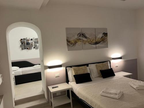 Un ou plusieurs lits dans un hébergement de l'établissement Affittacamere Sull'Arco