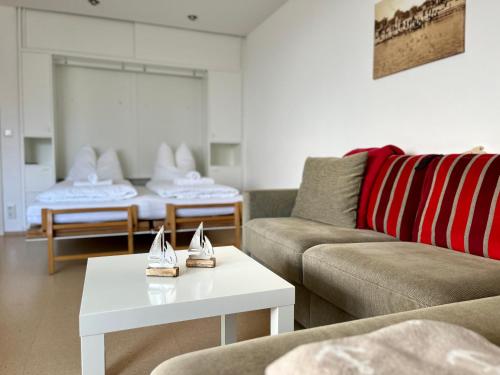 Ένα ή περισσότερα κρεβάτια σε δωμάτιο στο Strand Suite