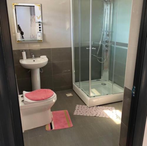 a bathroom with a shower and a toilet and a sink at PARADISE VIEW #73 in Bathurst