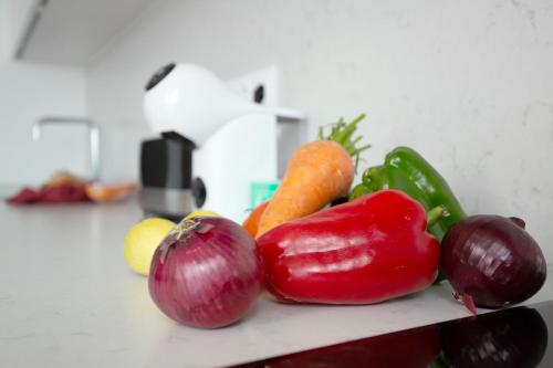 a bunch of vegetables sitting on a kitchen counter at Wonderful penthouse city and beach in Las Palmas de Gran Canaria