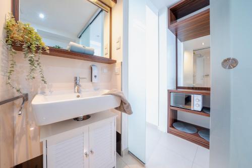 a bathroom with a sink and a mirror at App 14 Entspannen im Wellengang! in Dranske