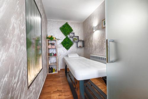 a small bathroom with a white sink in a room at Family Hotel The View & SPA in Tsigov Chark