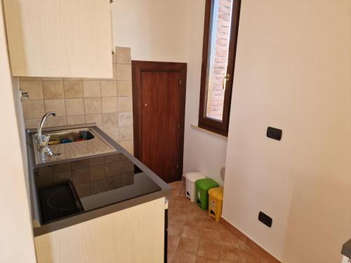 a kitchen with a sink and a counter top at La Torretta in Palestrina