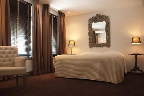 Ένα ή περισσότερα κρεβάτια σε δωμάτιο στο Hotel Mauritz