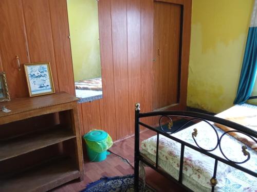 Postel nebo postele na pokoji v ubytování Benus Darjeeling Home A Backpacker Hub