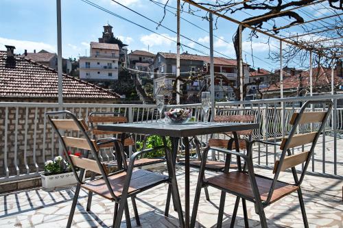 a table and chairs on top of a balcony at Apartman Zvijerko in Trebinje