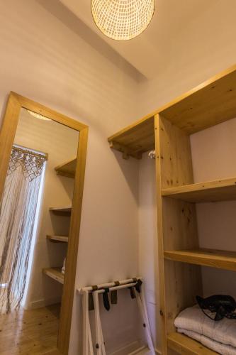 a room with bunk beds and a mirror at SALT SUITES MILOS in Pollonia