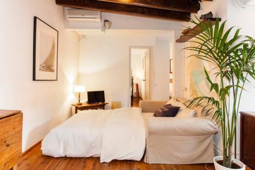 Ένα ή περισσότερα κρεβάτια σε δωμάτιο στο Canela Homes BARCELONA BORN