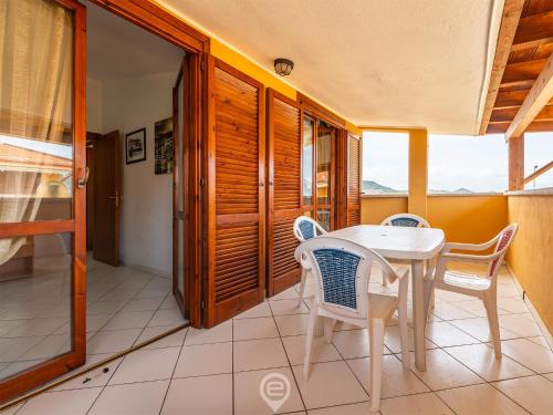 a dining room with a table and chairs at Villasimius Coastal Nest in Villasimius