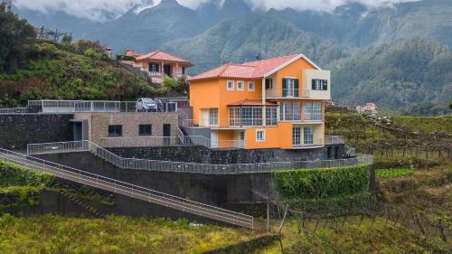 a house on the side of a mountain at The Mountain View, By OP in São Vicente
