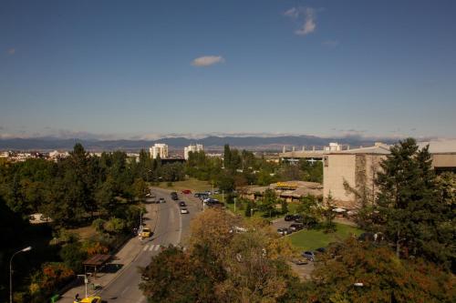 an aerial view of a city with a road and buildings at Triada Hotel in Sofia