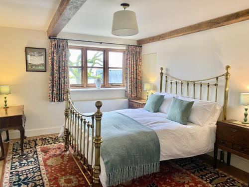 מיטה או מיטות בחדר ב-Manor Farm House