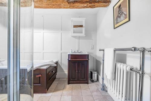 a bathroom with a shower and a sink at Manor Farm House in Kilmington