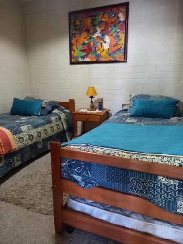 En eller flere senger på et rom på Casa en Villarrica