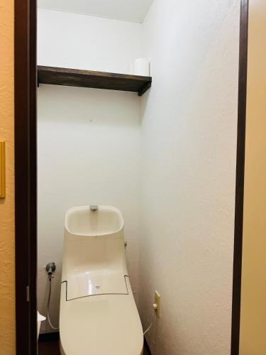 a bathroom with a white toilet in a room at Rest collection Fushimi-Inari Kyoto in Kyoto