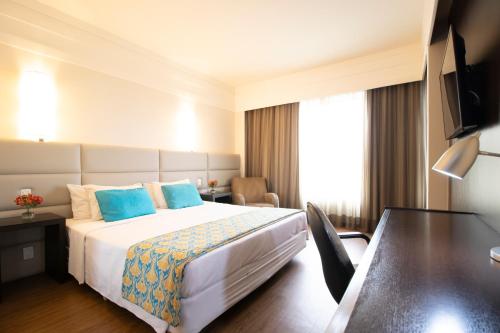 Postel nebo postele na pokoji v ubytování Bourbon Hotel Savassi - Belo Horizonte