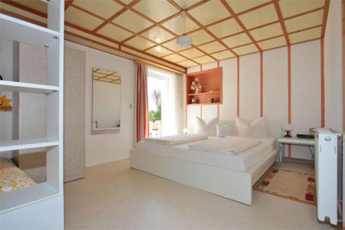Ένα ή περισσότερα κρεβάτια σε δωμάτιο στο Haus König Ferienwohnung 1 und 2
