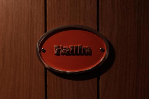 a red plate on a wooden door with the wordforth at Stein Inn in Stein