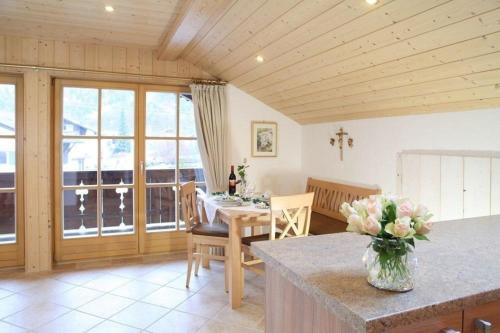 a kitchen and dining room with a table and chairs at Appartement in Farchant in Farchant
